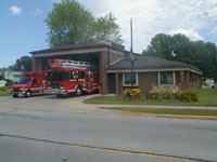 Exterior of Fire Station 3 with parked fire trucks 